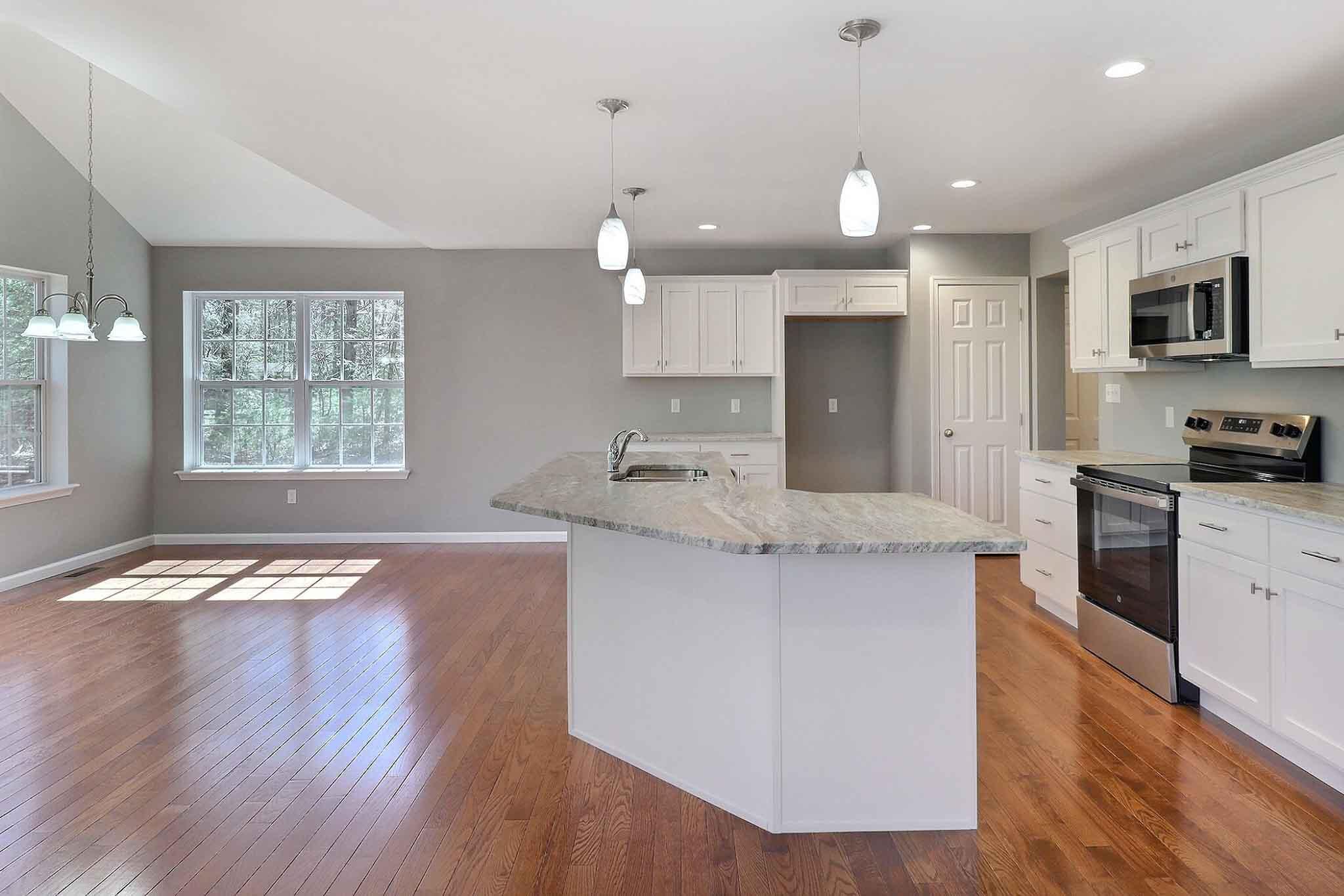 552 Long Mountain Road Effort, PA 18330 - Photo 10 of 47 a kitchen with stainless steel appliances granite countertop a sink stove and refrigerator
