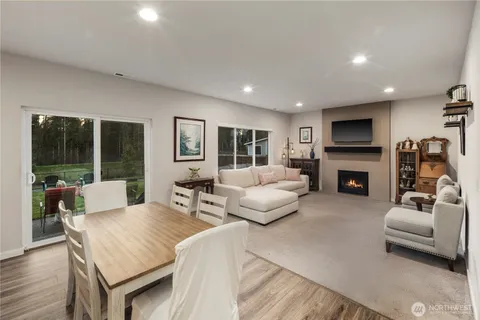 a living room with furniture fireplace and flat screen tv