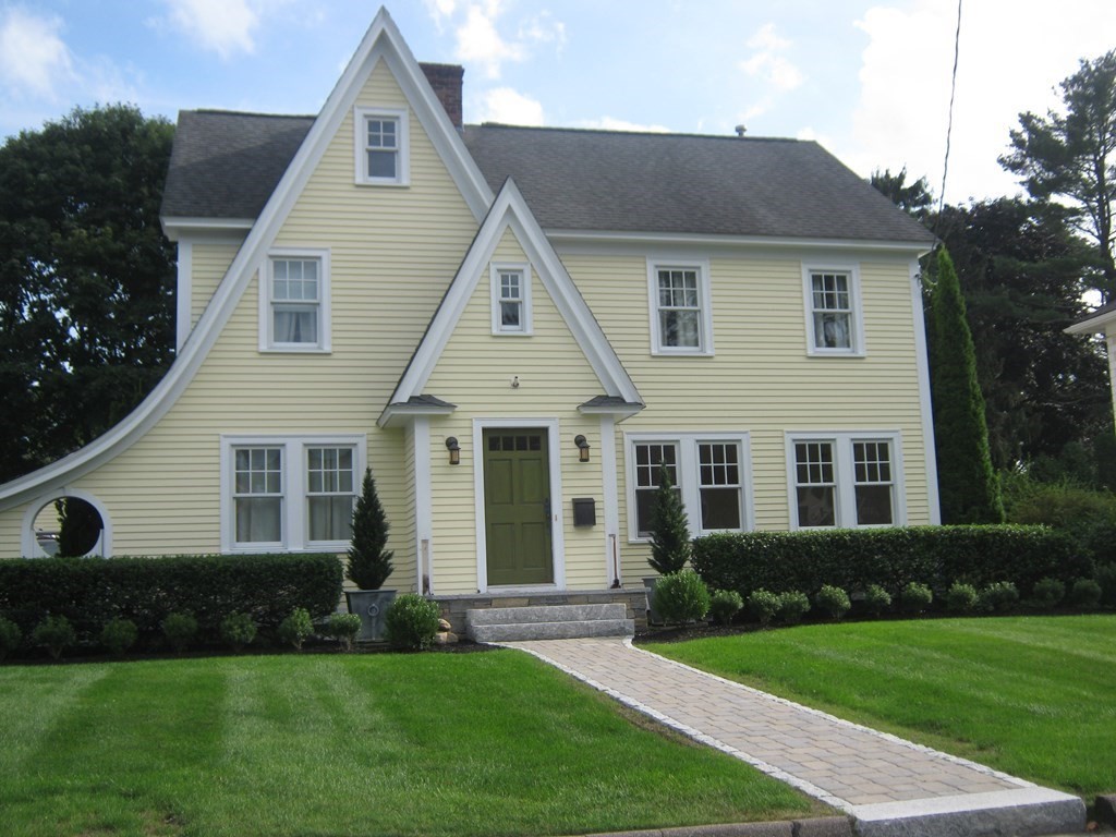a front view of a house with a yard