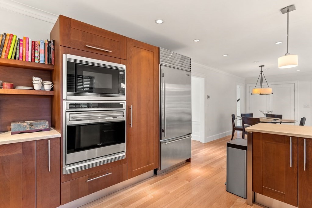22 Robert Road Marblehead, MA 01945 - Photo 12 of 41 a kitchen with stainless steel appliances granite countertop a refrigerator and a stove top oven