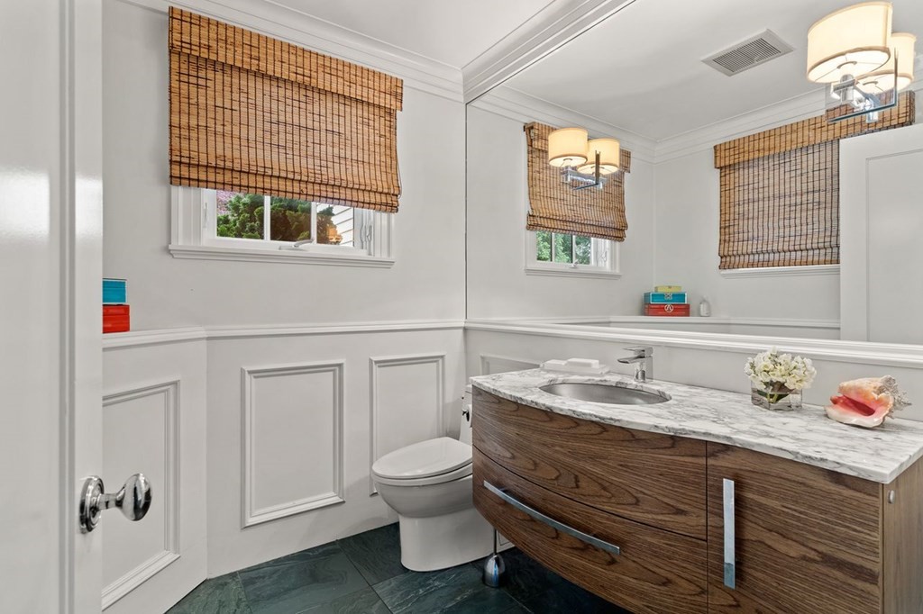 22 Robert Road Marblehead, MA 01945 - Photo 20 of 41 a bathroom with a granite countertop toilet sink and mirror