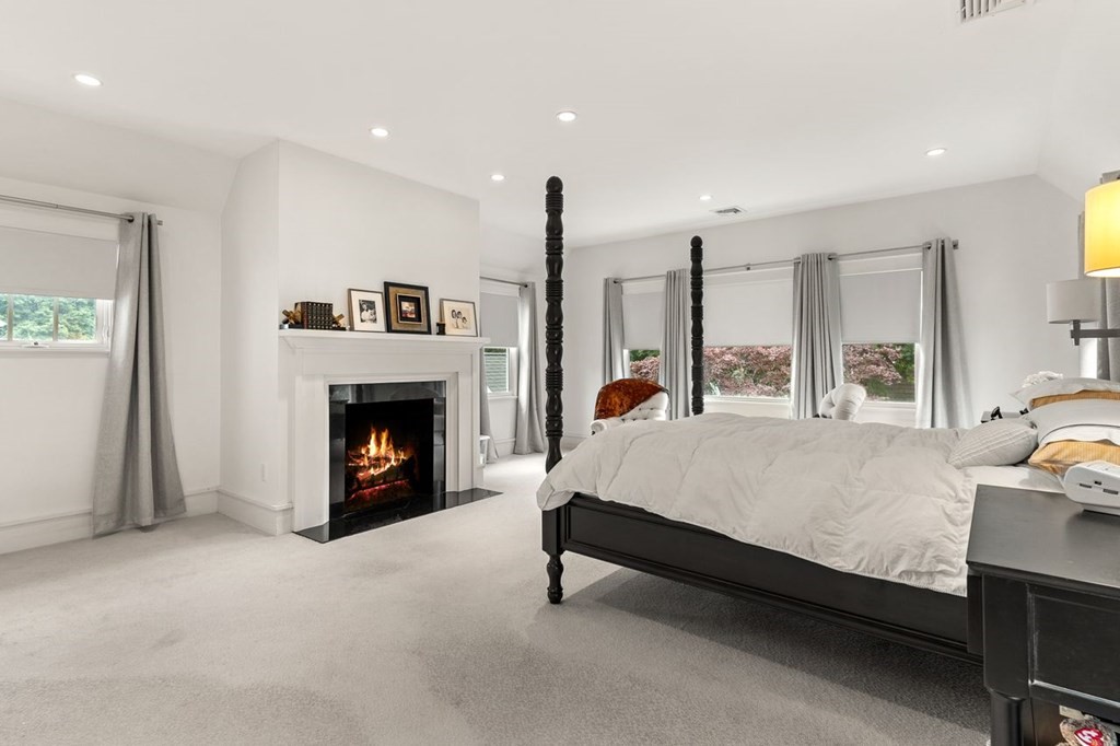 22 Robert Road Marblehead, MA 01945 - Photo 23 of 41 a bed room with a bed and a fireplace