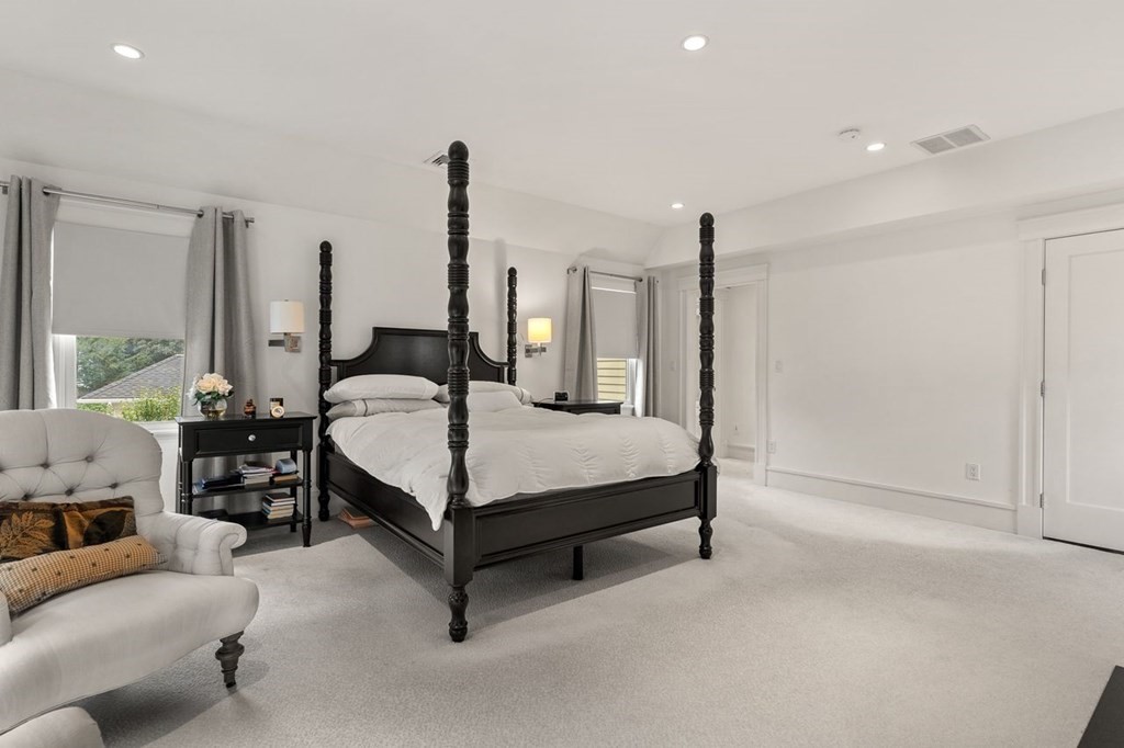 22 Robert Road Marblehead, MA 01945 - Photo 24 of 41 a bedroom with a bed lamp and window