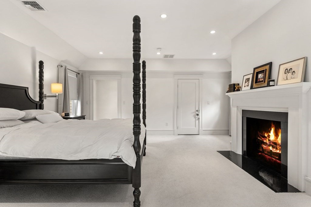 22 Robert Road Marblehead, MA 01945 - Photo 25 of 41 a bed room with a bed and a fireplace