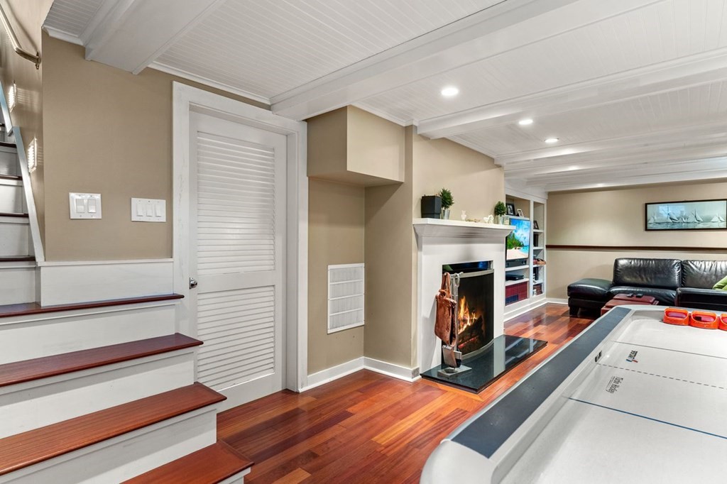 22 Robert Road Marblehead, MA 01945 - Photo 32 of 41 a bedroom with furniture and a flat screen tv