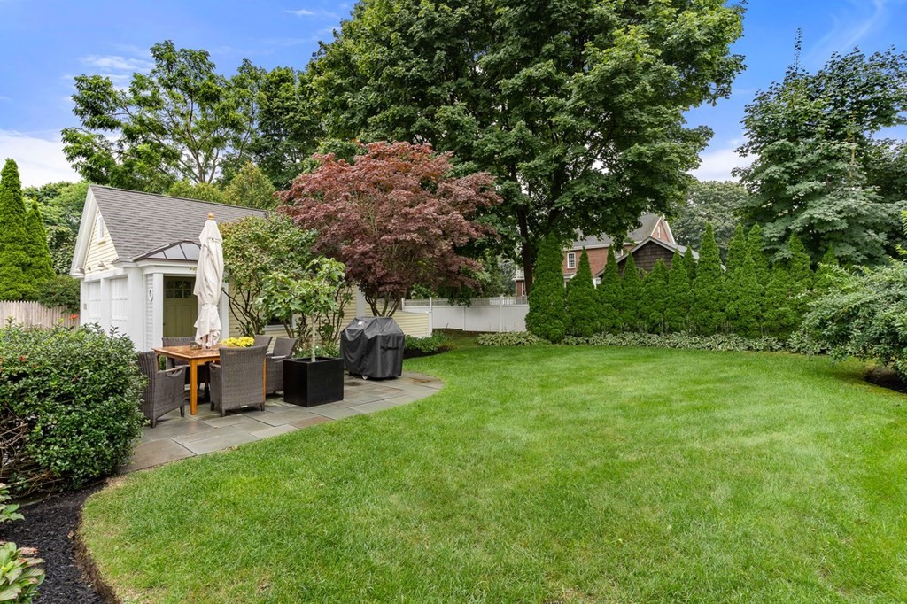 22 Robert Road Marblehead, MA 01945 - Photo 37 of 41 a view of a patio with table and chairs potted plants and large tree