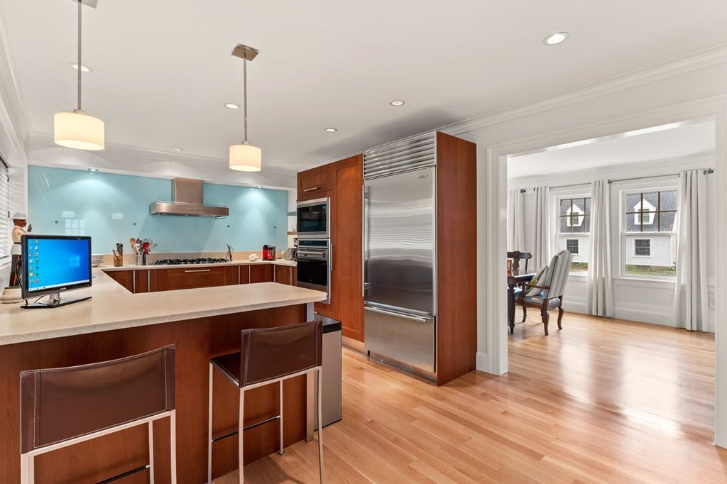22 Robert Road Marblehead, MA 01945 - Photo 9 of 41 a kitchen with stainless steel appliances granite countertop a refrigerator a sink and a stove