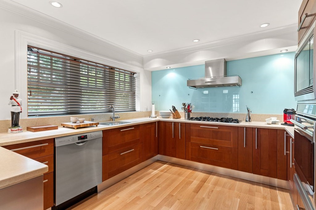 22 Robert Road Marblehead, MA 01945 - Photo 10 of 41 a kitchen with stainless steel appliances a sink stove and cabinets
