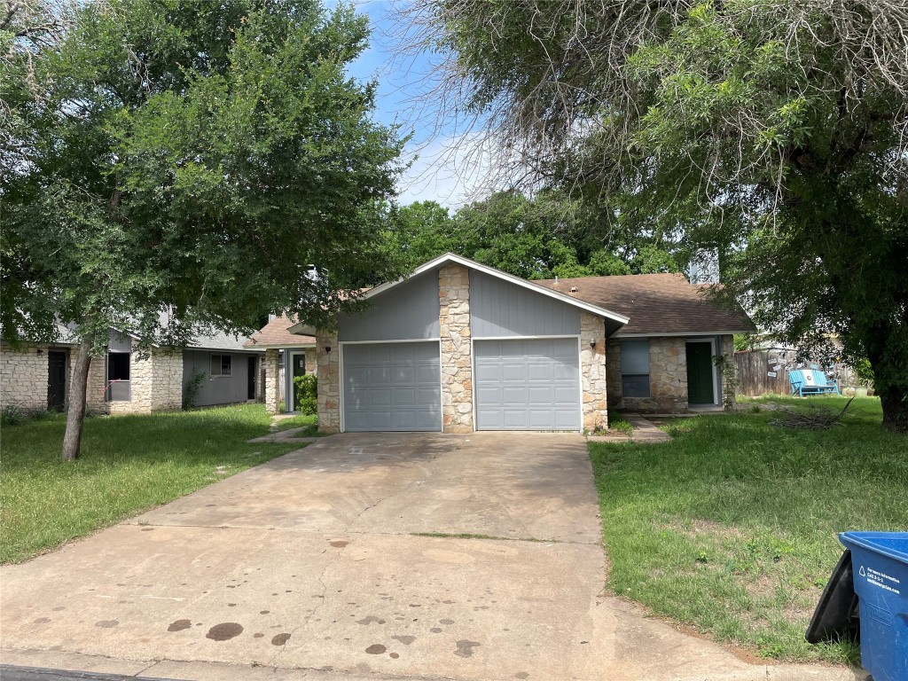 7506 St Amant Place Austin, TX 78749 - Photo 2 of 16 front view of a house with a yard and trees