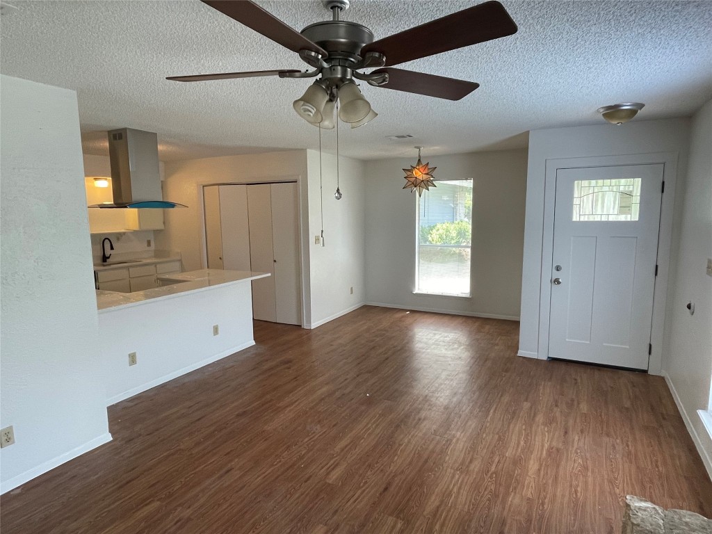 7506 St Amant Place Austin, TX 78749 - Photo 3 of 16 a view of empty room with wooden floor and fan