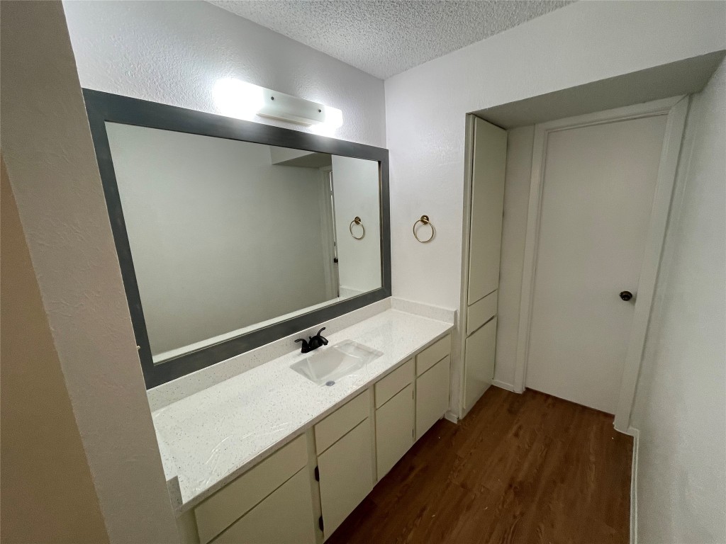 7506 St Amant Place Austin, TX 78749 - Photo 9 of 16 a bathroom with a sink and mirror