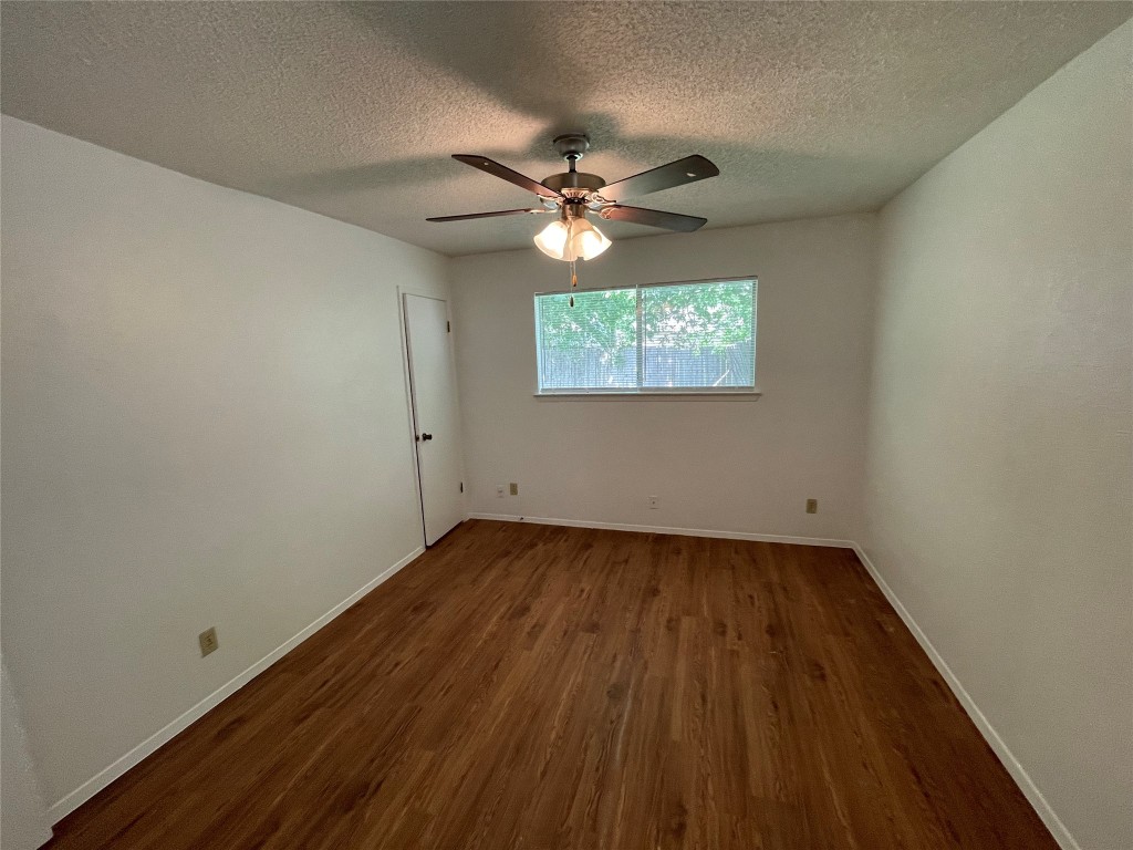7506 St Amant Place Austin, TX 78749 - Photo 10 of 16 wooden floor in an empty room with a window