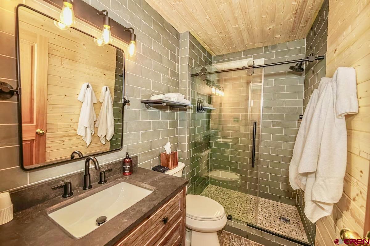 20 Hunter Hill Road, Unit 202 Crested Butte, CO 81225 - Photo 11 of 25 a bathroom with a sink toilet and shower
