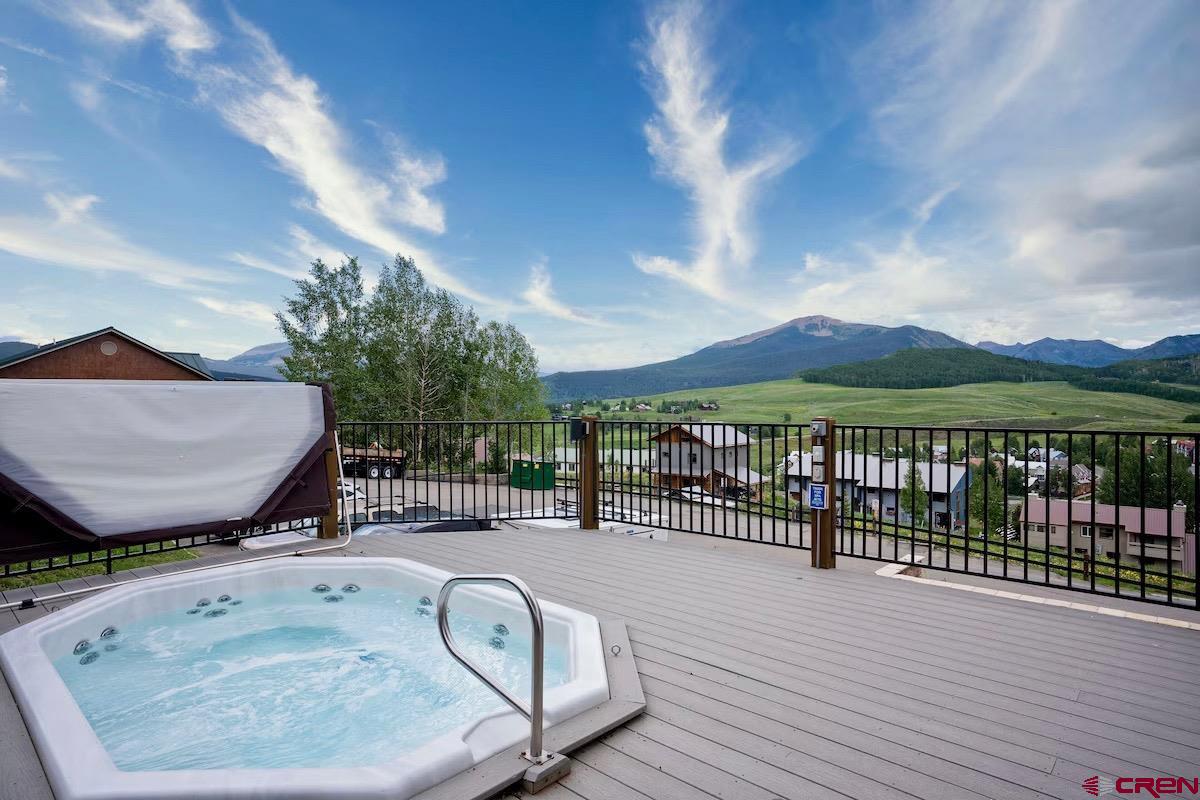 20 Hunter Hill Road, Unit 202 Crested Butte, CO 81225 - Photo 15 of 25 a view of a swimming pool with a lounge chair