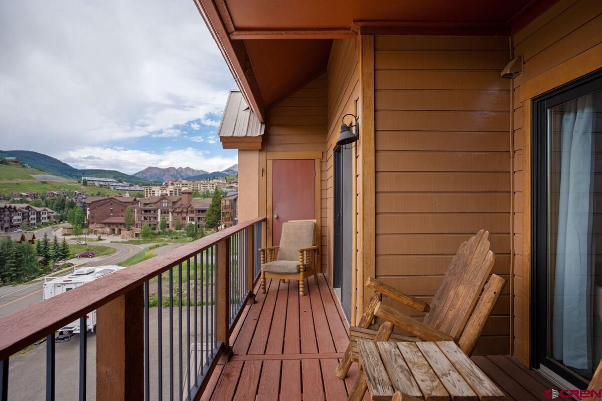20 Hunter Hill Road, Unit 202 Crested Butte, CO 81225 - Photo 16 of 25 a view of balcony with wooden floor and outdoor seating