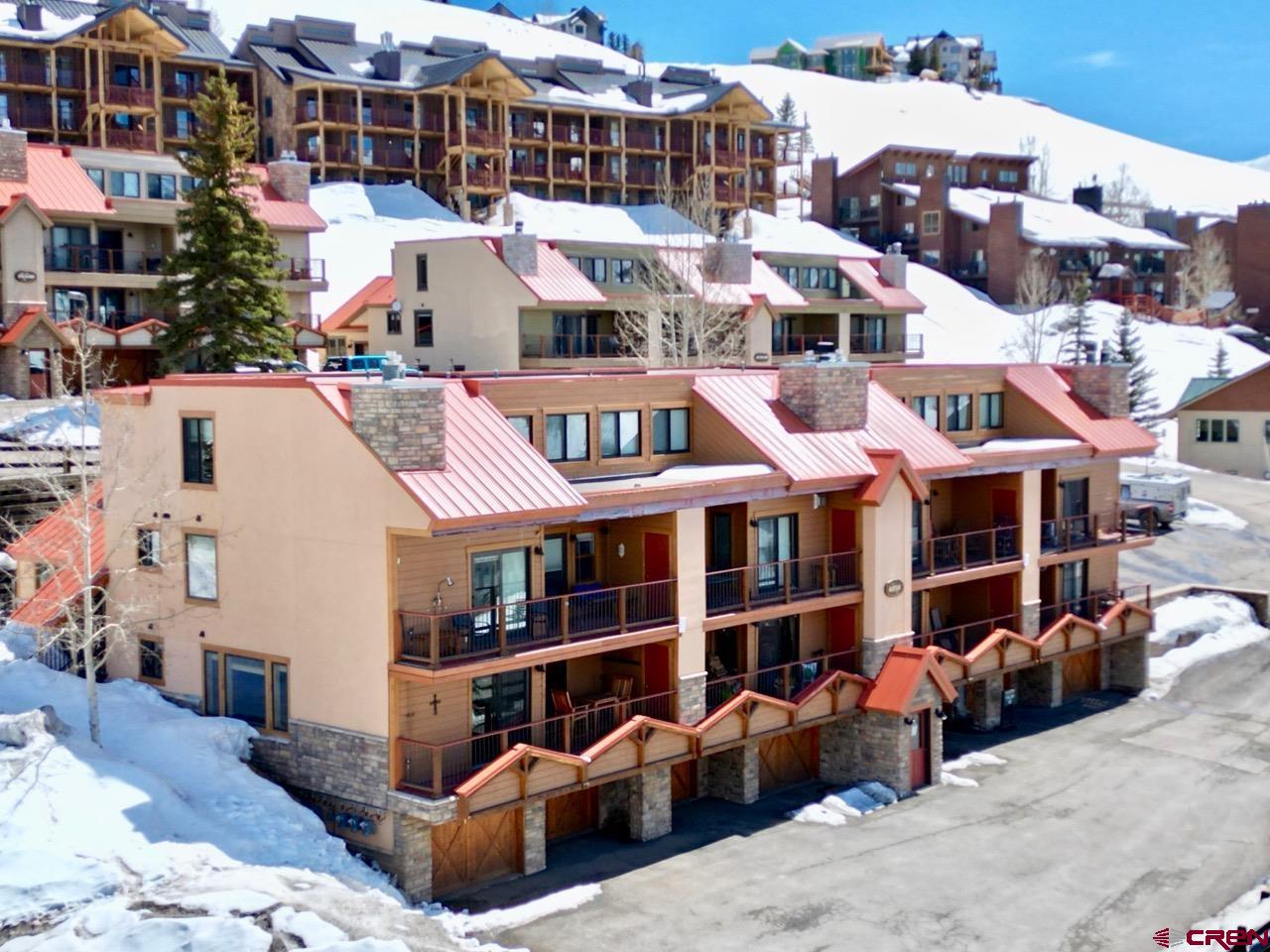 20 Hunter Hill Road, Unit 202 Crested Butte, CO 81225 - Photo 23 of 25 a front view of a building with street view