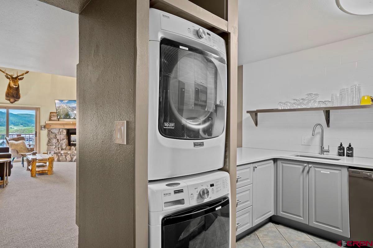 20 Hunter Hill Road, Unit 202 Crested Butte, CO 81225 - Photo 8 of 25 a utility room with sink dryer and washer