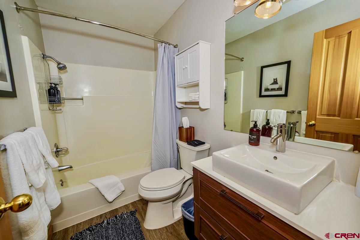 20 Hunter Hill Road, Unit 202 Crested Butte, CO 81225 - Photo 10 of 25 a bathroom with a sink a toilet and shower