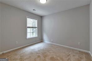 3686 Claredun Court Cumming, GA 30040 - Photo 18 of 29 an empty room with a window