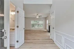 a view of an entryway with wooden floor