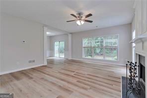 3686 Claredun Court Cumming, GA 30040 - Photo 7 of 29 a view of an empty room with a window and wooden floor