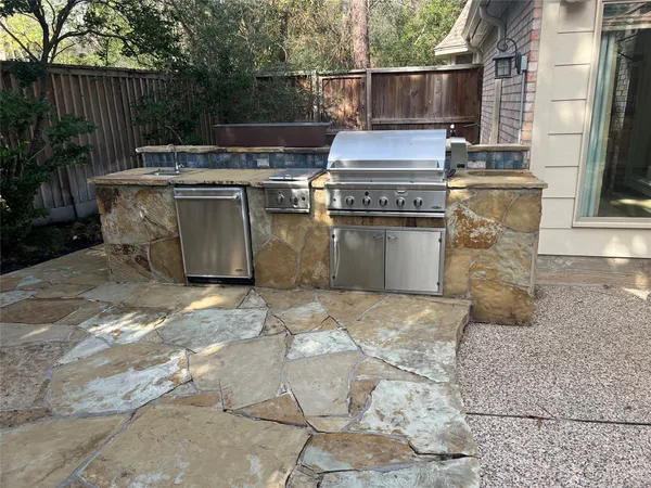a view of a kitchen with a sink and cabinets