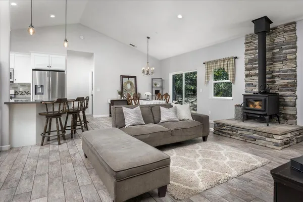 a living room with furniture and large windows