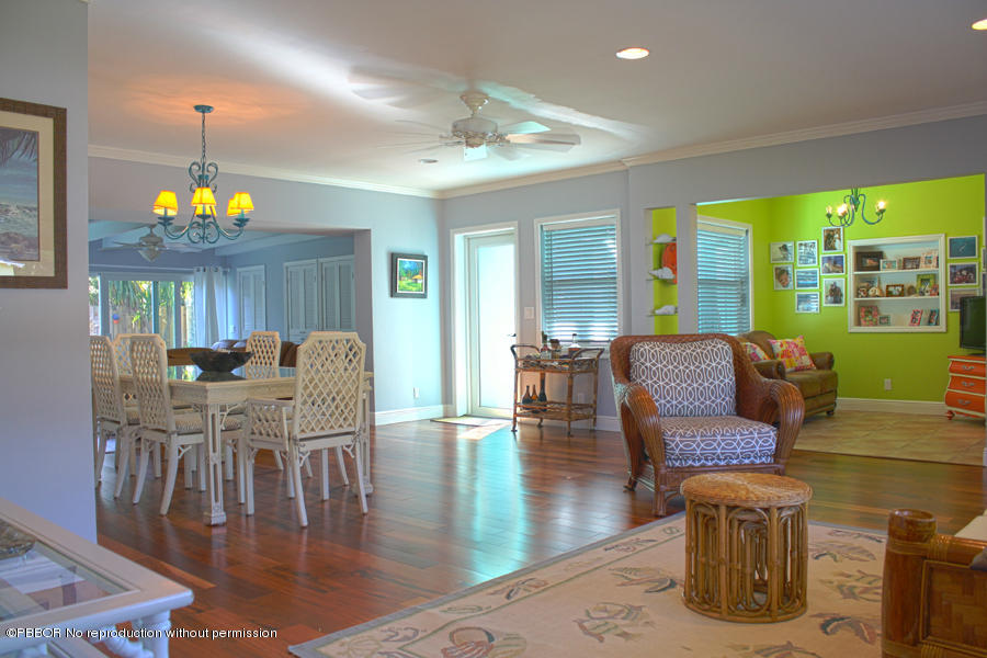 216 Costello Road West Palm Beach, FL 33405 - Photo 1 of 25 a living room with furniture and a table