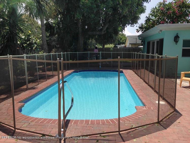 216 Costello Road West Palm Beach, FL 33405 - Photo 13 of 25 a view of a backyard with swimming pool