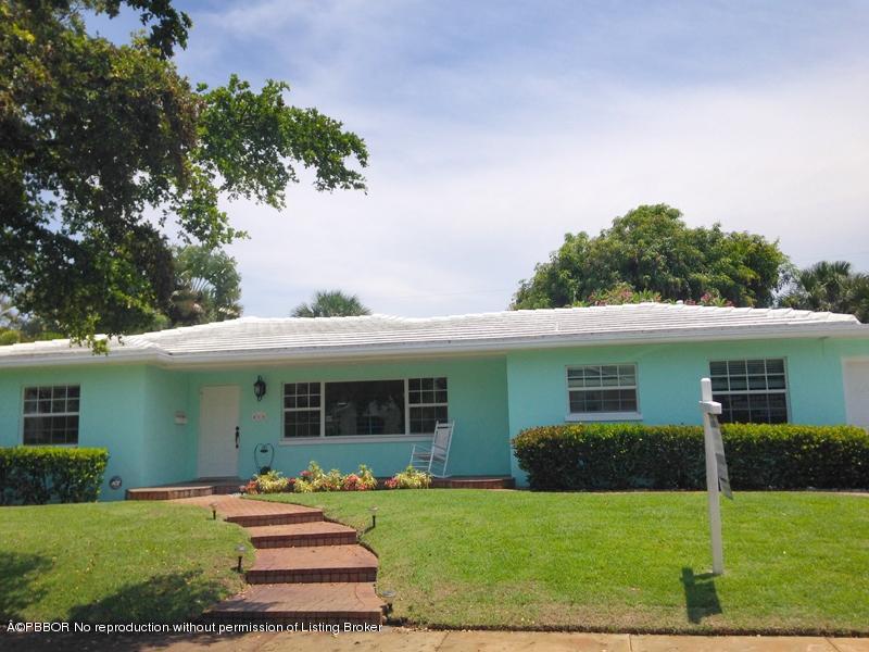 216 Costello Road West Palm Beach, FL 33405 - Photo 15 of 25 a front view of a house with a yard