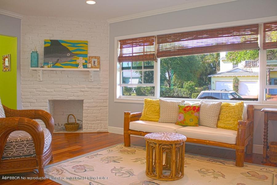 216 Costello Road West Palm Beach, FL 33405 - Photo 18 of 25 a living room with fireplace furniture and a large window