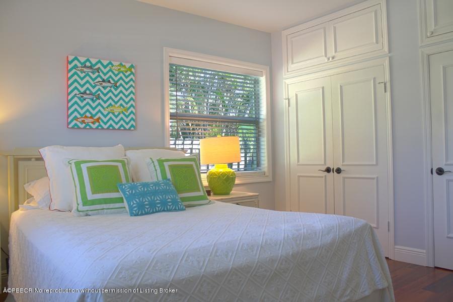 216 Costello Road West Palm Beach, FL 33405 - Photo 23 of 25 a bedroom with a bed painting on wall and a window