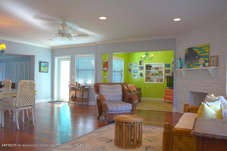 216 Costello Road West Palm Beach, FL 33405 - Photo 25 of 25 a living room with fireplace furniture and a large window