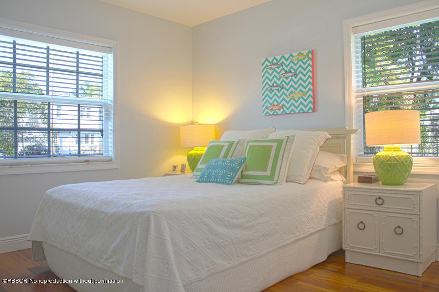 216 Costello Road West Palm Beach, FL 33405 - Photo 5 of 25 a bedroom with a bed and window