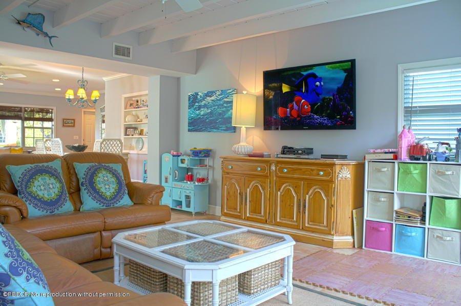 216 Costello Road West Palm Beach, FL 33405 - Photo 10 of 25 a living room with furniture and a flat screen tv