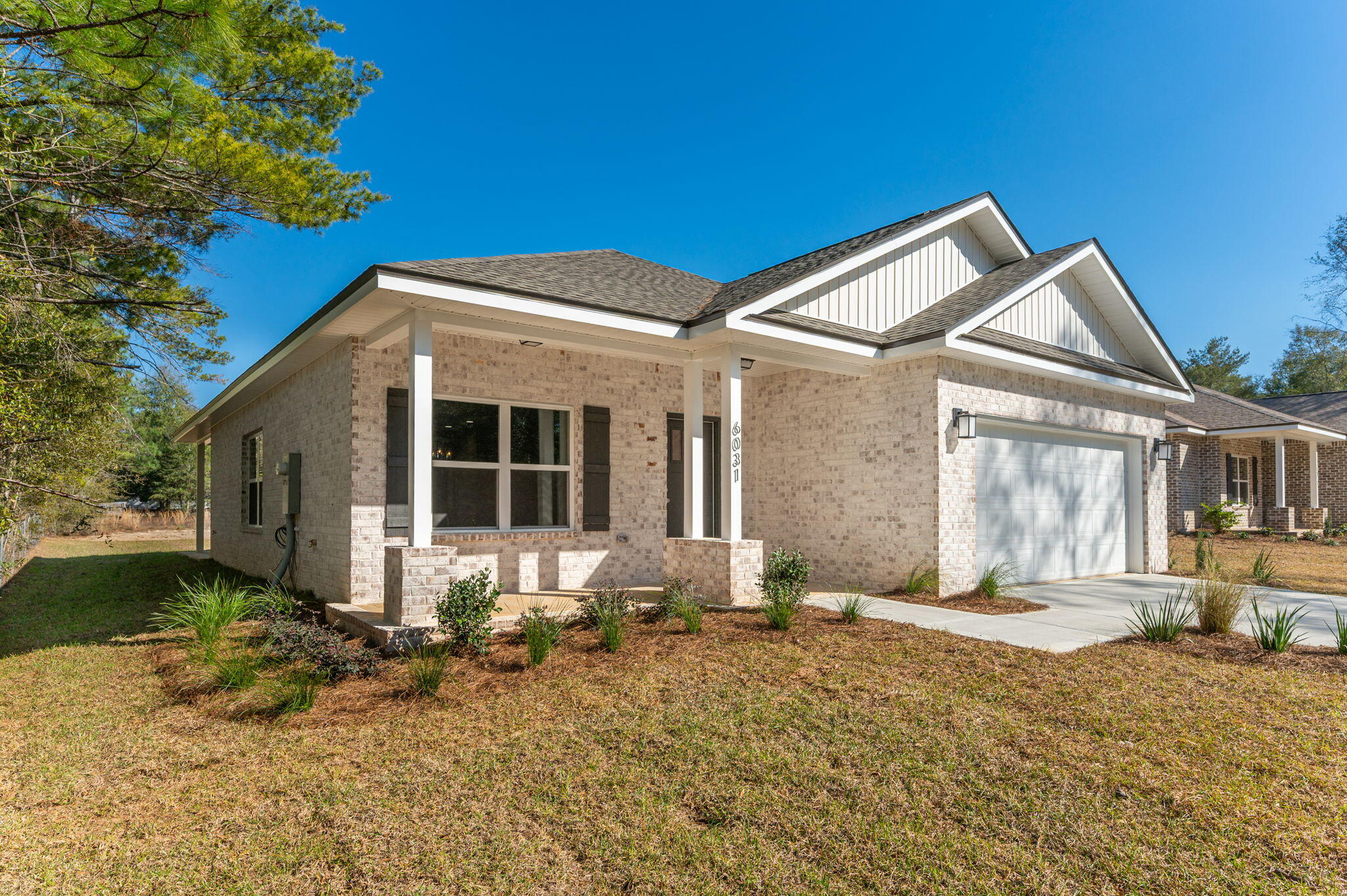 6031 Sand Hill Road Crestview, FL 32539 - Photo 2 of 11 a front view of a house with a yard
