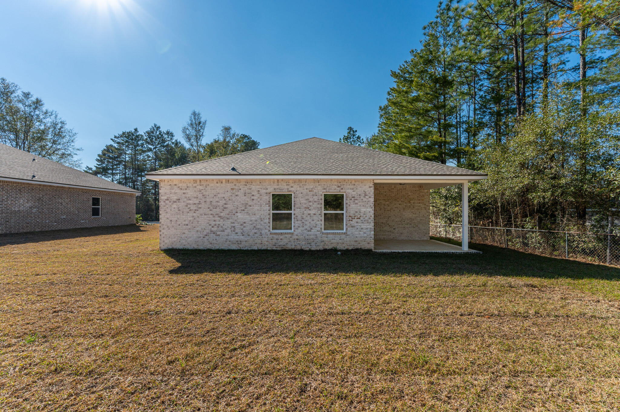 6031 Sand Hill Road Crestview, FL 32539 - Photo 6 of 11 a view of a house with a yard