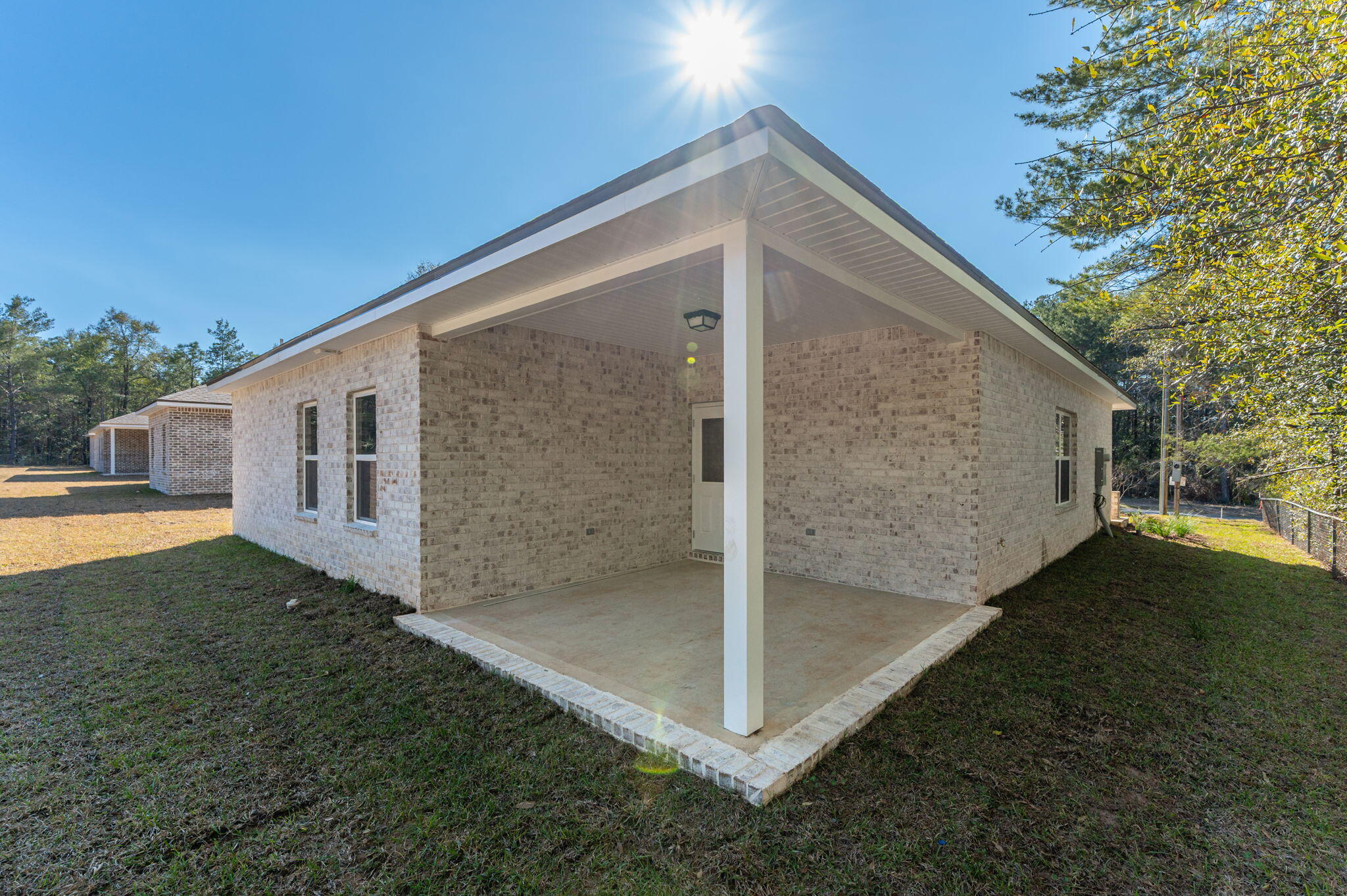 6031 Sand Hill Road Crestview, FL 32539 - Photo 8 of 11 a backyard of a house with seating space