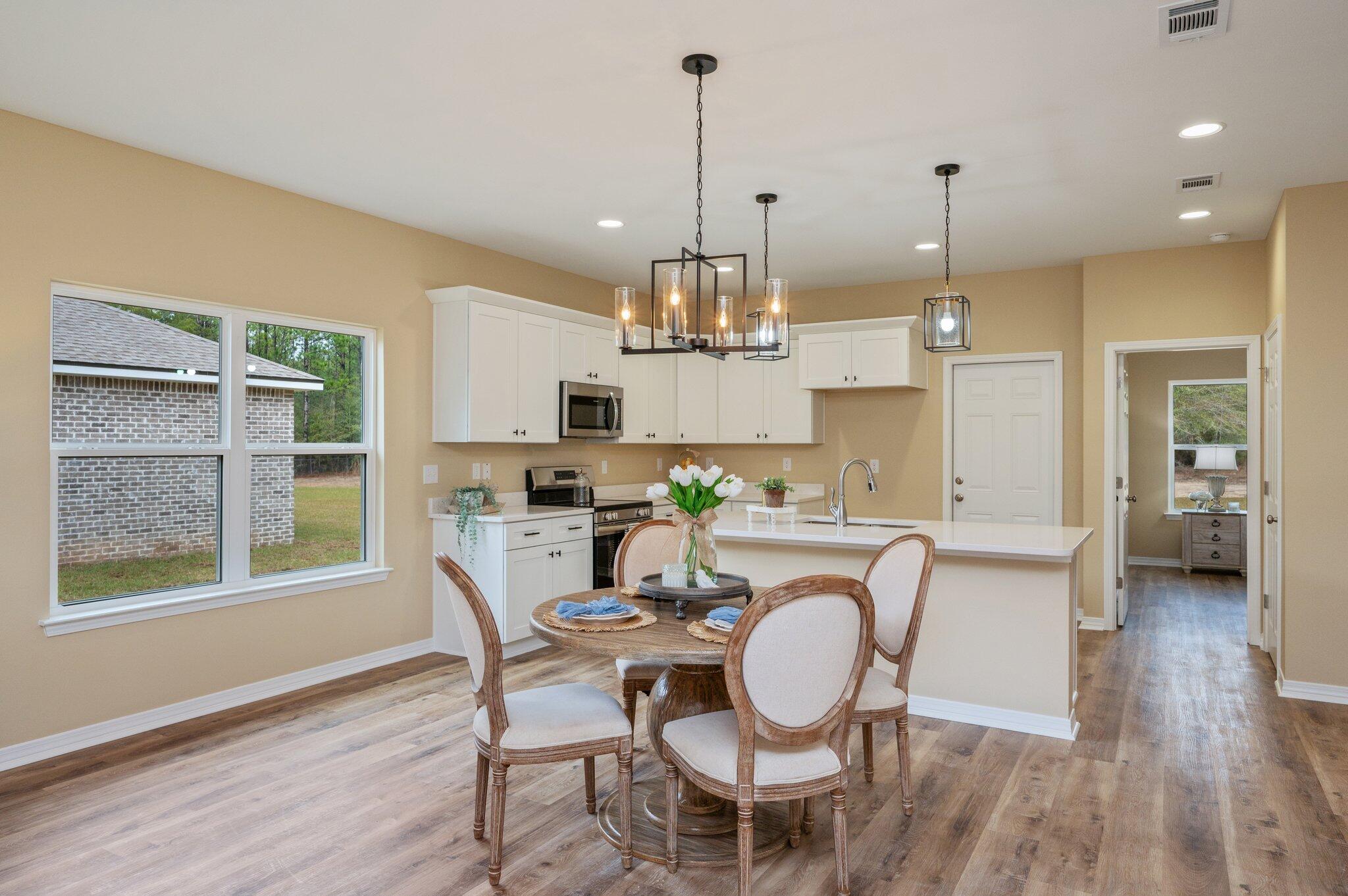 6031 Sand Hill Road Crestview, FL 32539 - Photo 9 of 11 a dining room with furniture and window