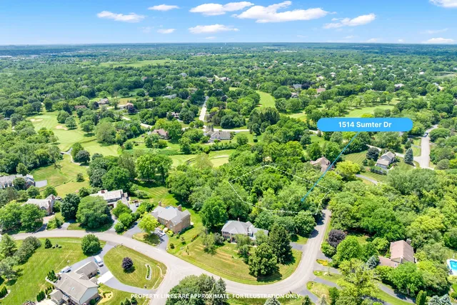 an aerial view of residential houses with outdoor space and street view