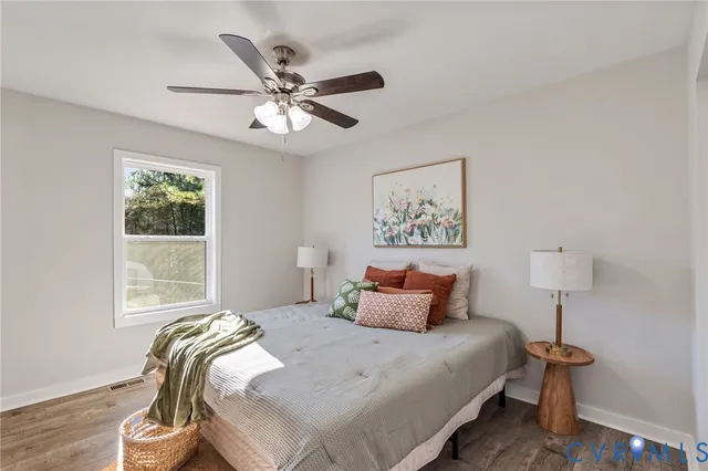 a bedroom with bed and a window