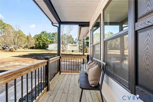 a view of a chairs and table in the balcony