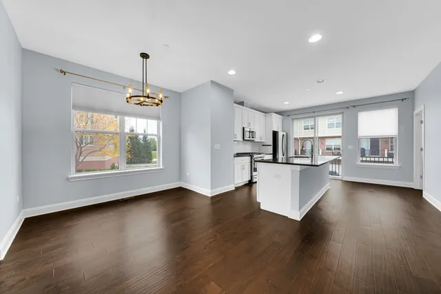 a view of kitchen with furniture and wooden floor