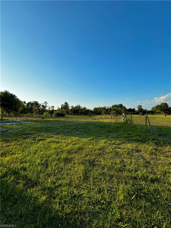 3435 Randall Boulevard Naples, FL 34120 - Photo 18 of 20 a view of a lake with houses in background
