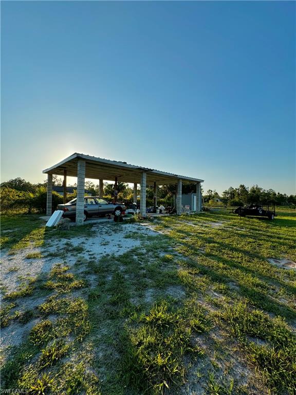 3435 Randall Boulevard Naples, FL 34120 - Photo 19 of 20 a house view with a garden space