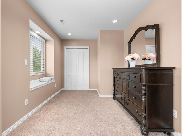 6849 North Black Powder Road Mountain Green, UT 84050 - Photo 14 of 43 Plush carpeted room featuring a window with built-in bench seating, recessed lighting, and a bi-fold closet