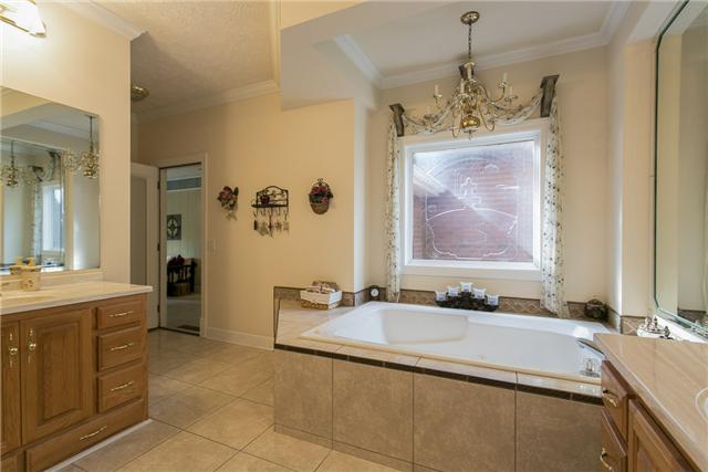 403 Shirley Road Smyrna, TN 37167 - Photo 9 of 20 Owners bathroom is large with a walk-in closet, double vanities, walk-in shower and whirlpool tub.