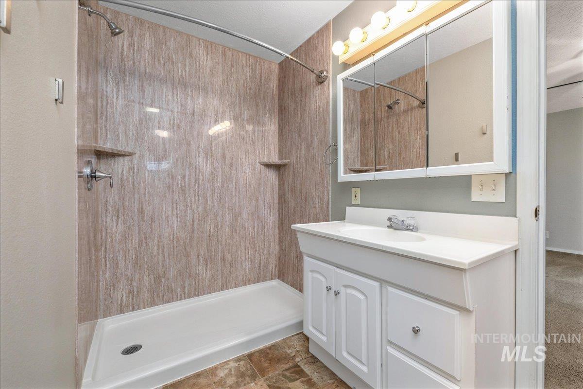 3002 Frozen Dog Road Emmett, ID 83617 - Photo 23 of 50 Full bathroom featuring vanity and a stall shower