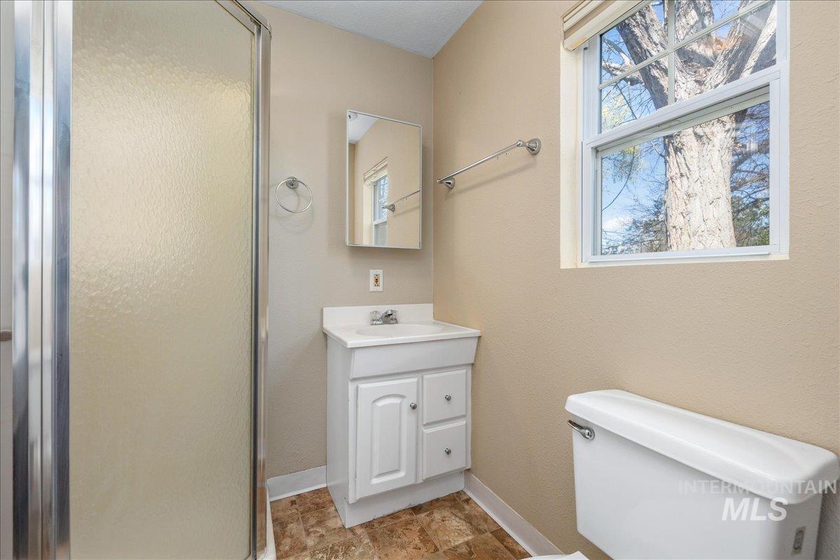 3002 Frozen Dog Road Emmett, ID 83617 - Photo 25 of 50 Bathroom with vanity and a stall shower