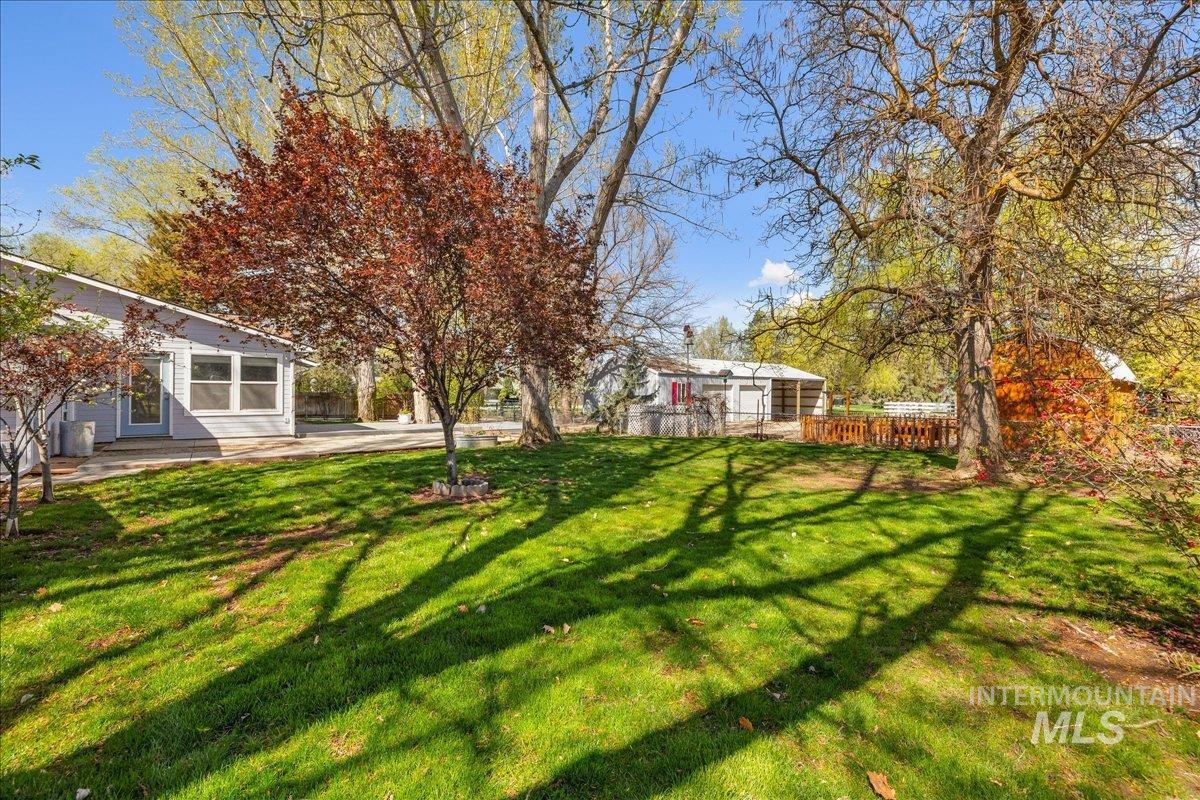3002 Frozen Dog Road Emmett, ID 83617 - Photo 35 of 50 View of green lawn featuring a patio area